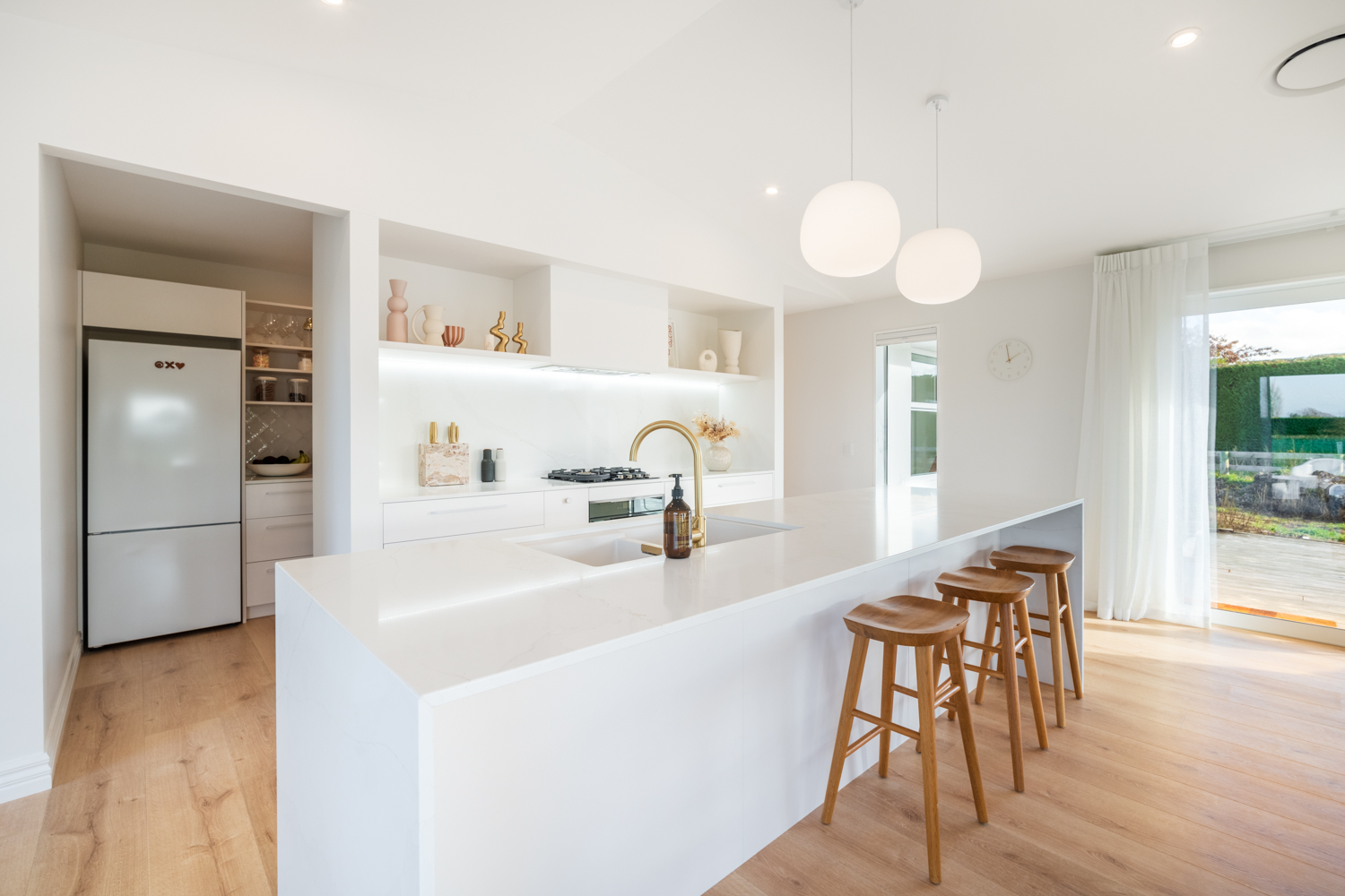 Modern white kitchen design with boho themes