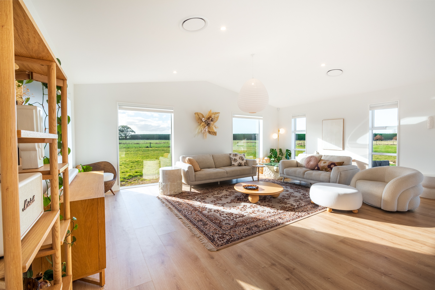 Open living area with raked ceiling and neutral tones