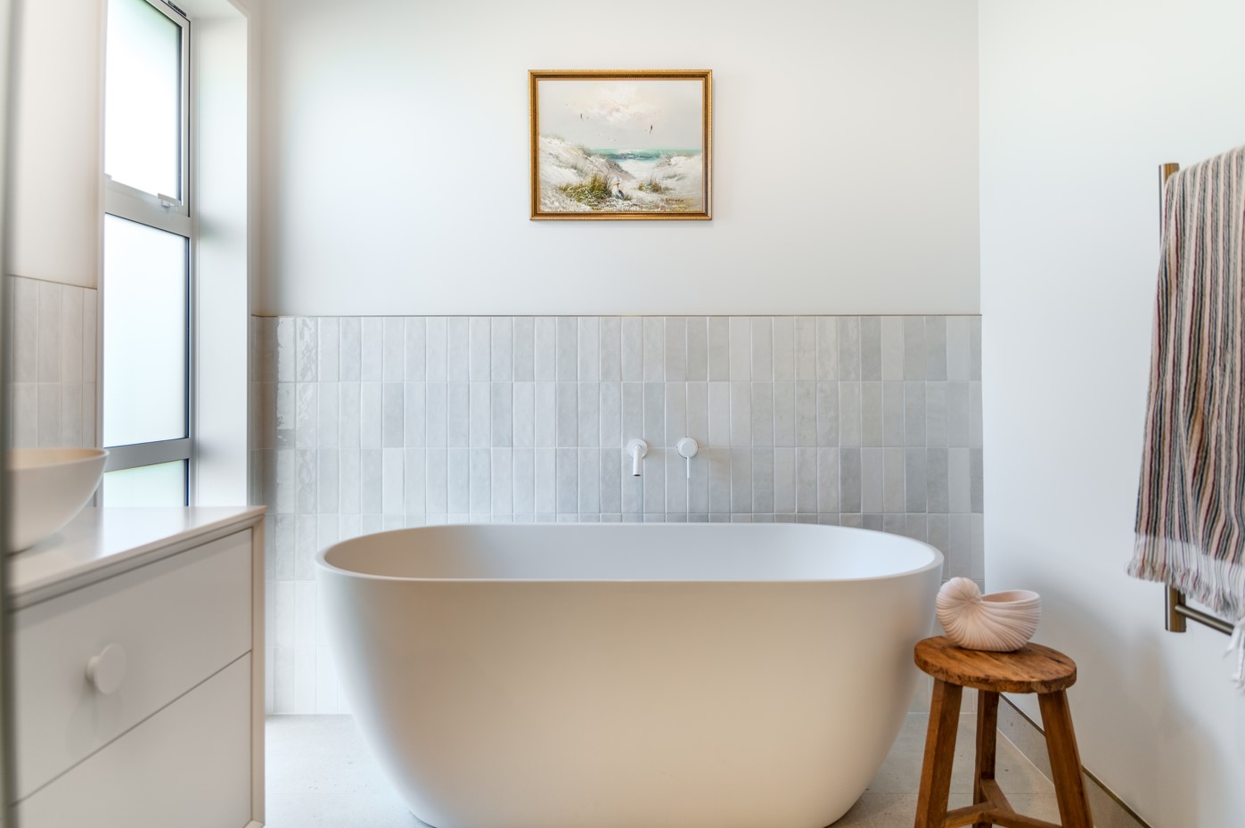 half high blue piano tiles and bath