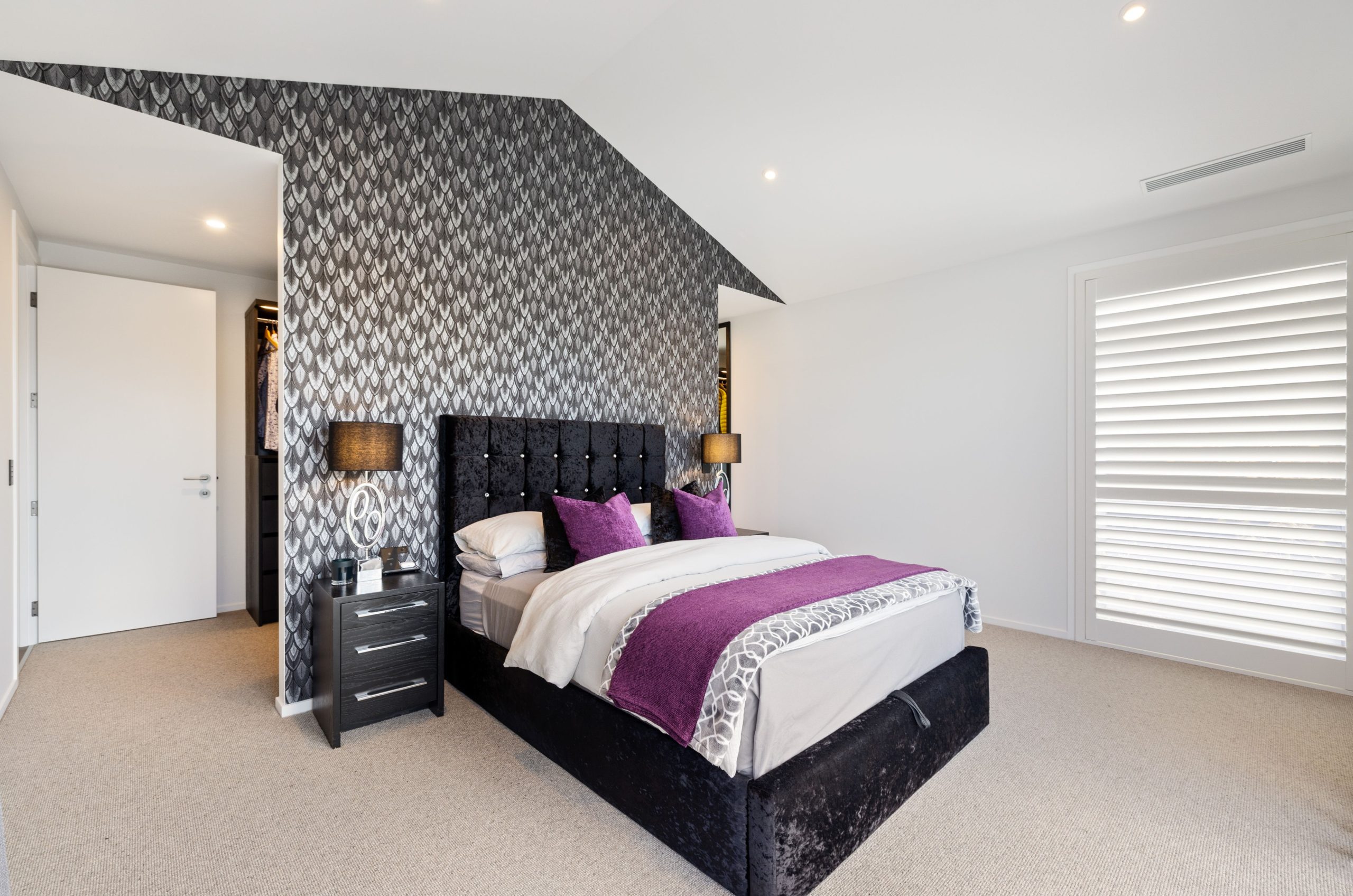 Master suite with walk-in wardrobe and oversized picture windows