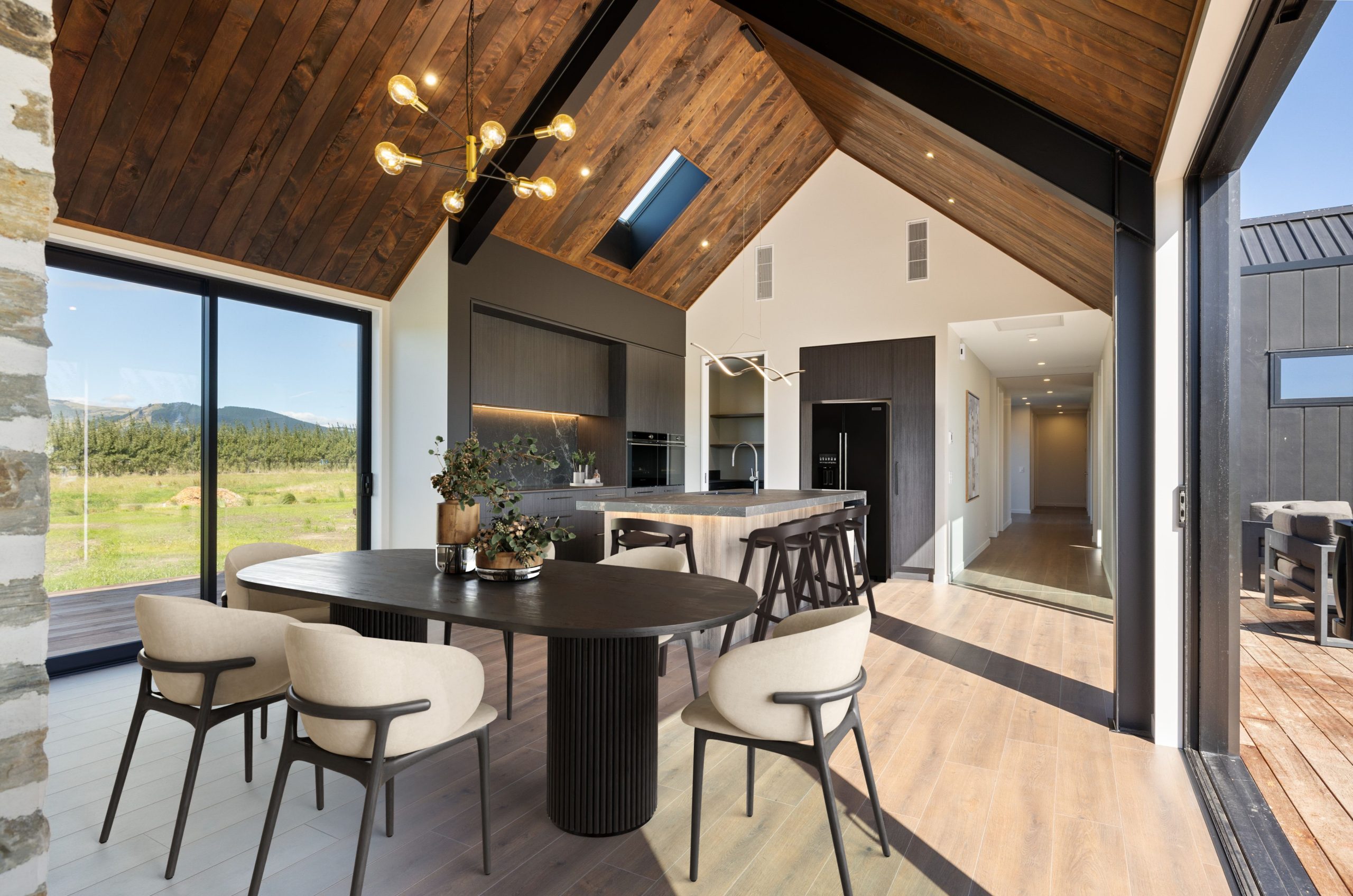 Large open-plan kitchen with butler’s pantry, stone benchtops and pendant lights