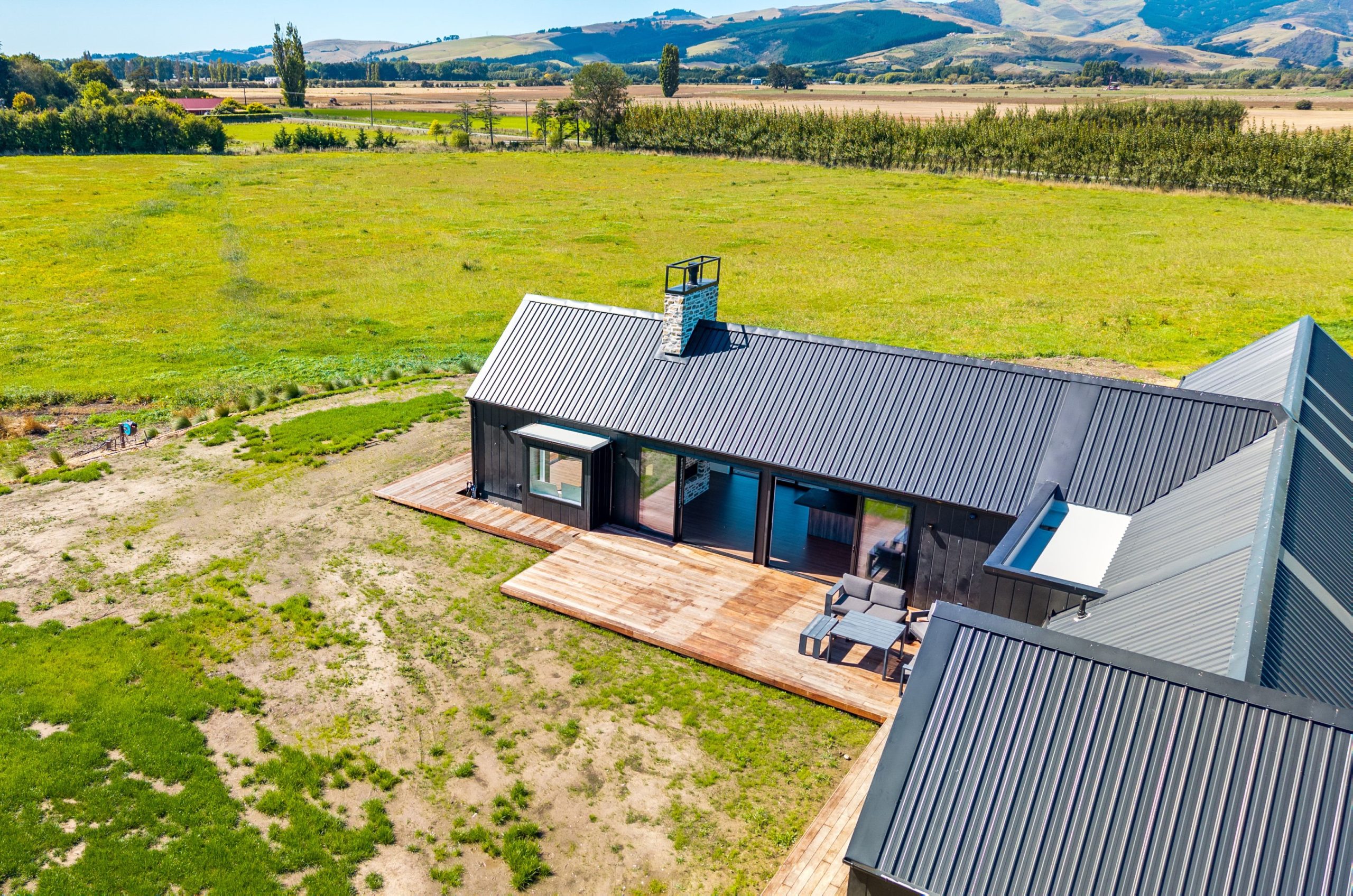 Outdoor entertaining area with covered alfresco and landscaped garden